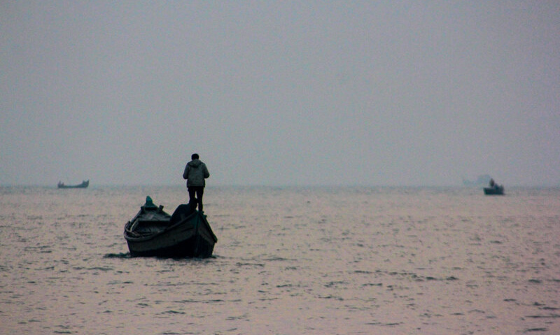 The sun has set. The sea calls, and the fisherman responds, ready for the day's bounty.